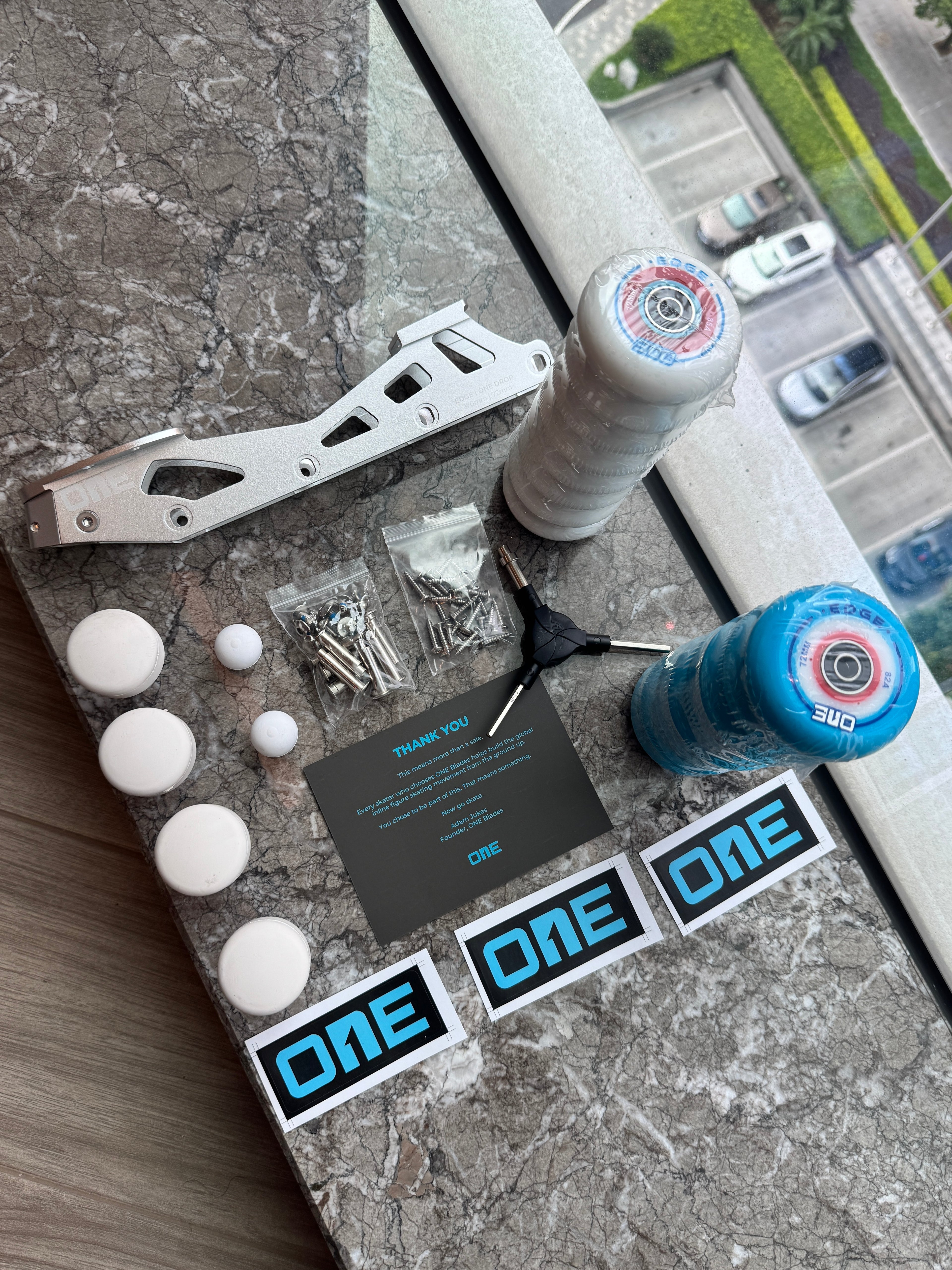 Product packaging with components and branding on a concrete surface