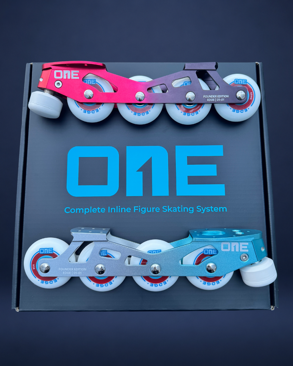 Box of 'ONE' complete inline figure skating system with Red and Cyan skates on a dark background