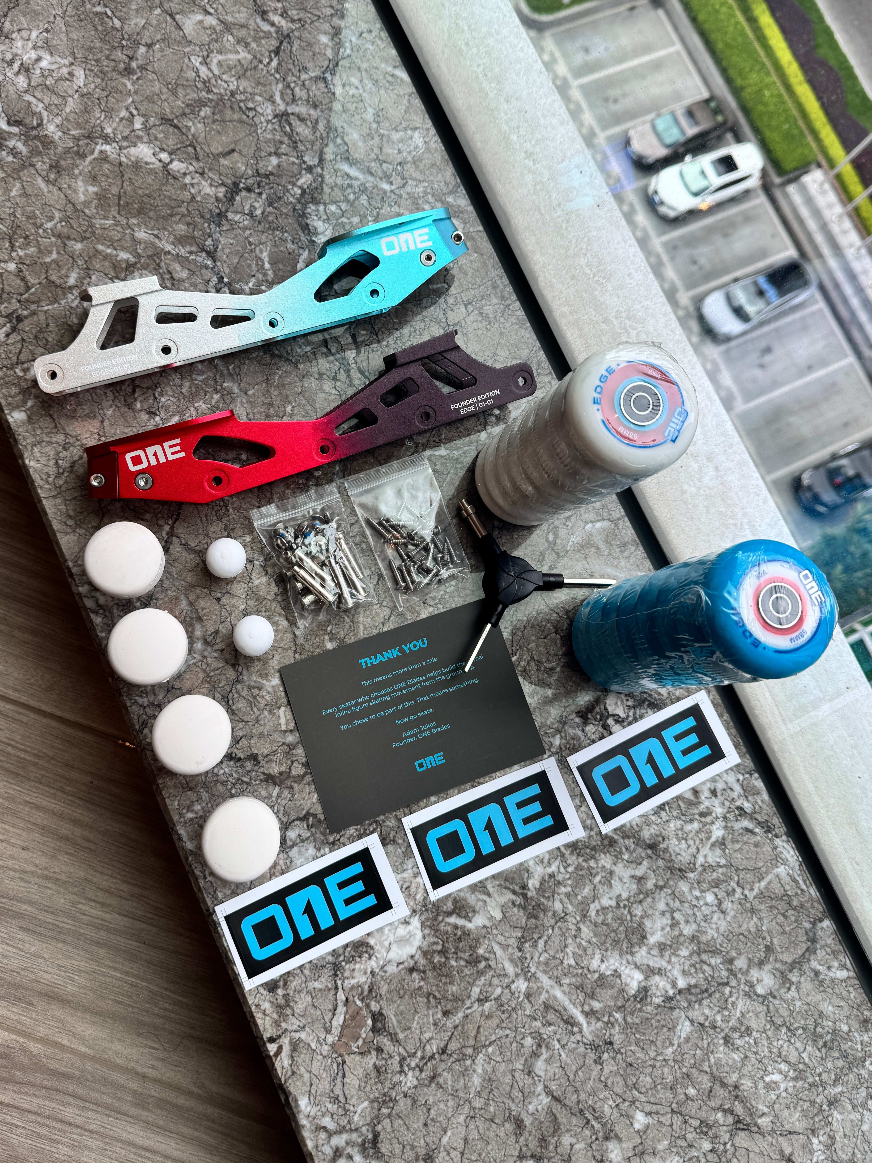 Collection of EDGE components with 'ONE' branding on a textured surface.