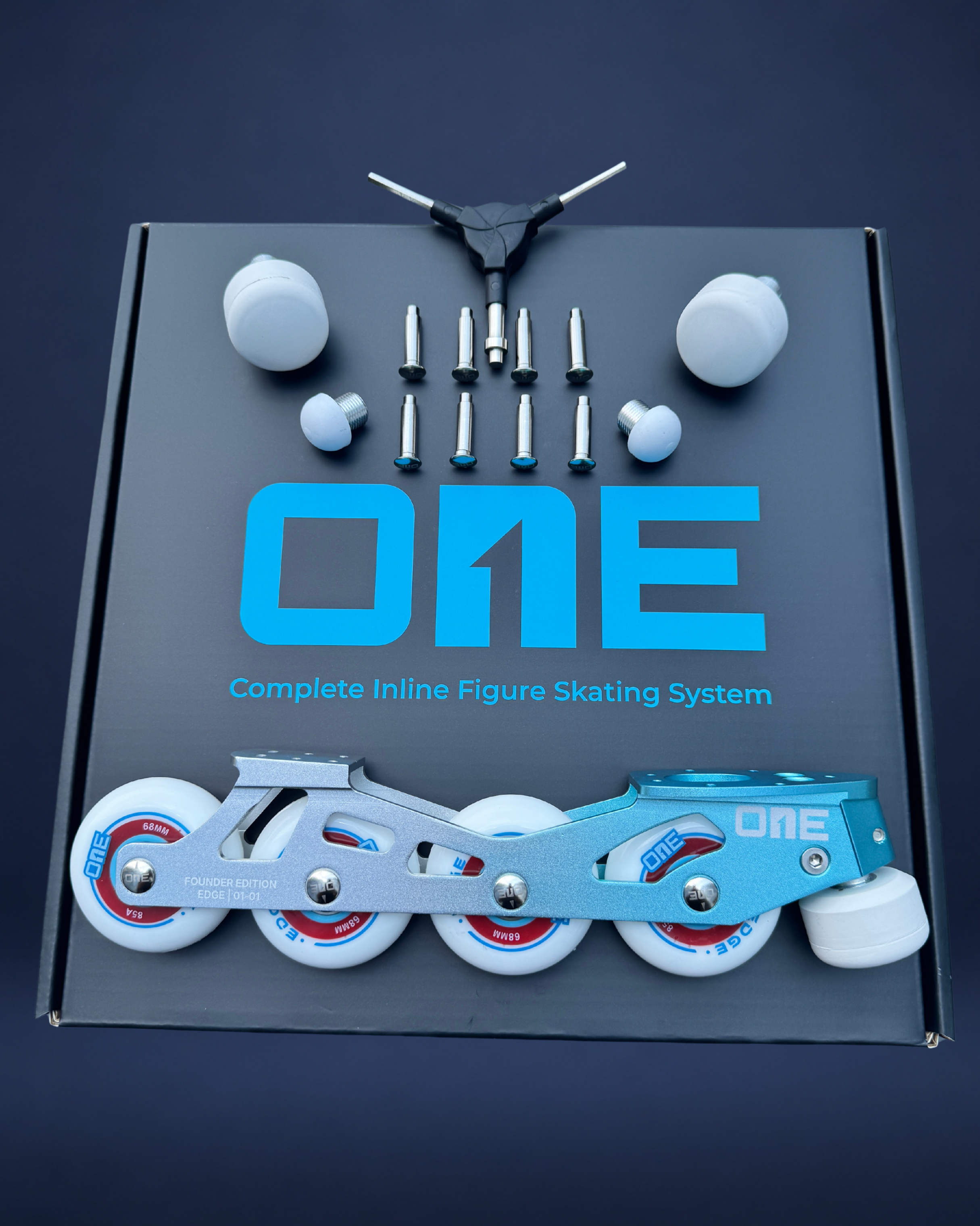 Box containing inline figure skating system with 'ONE' branding on a dark background
