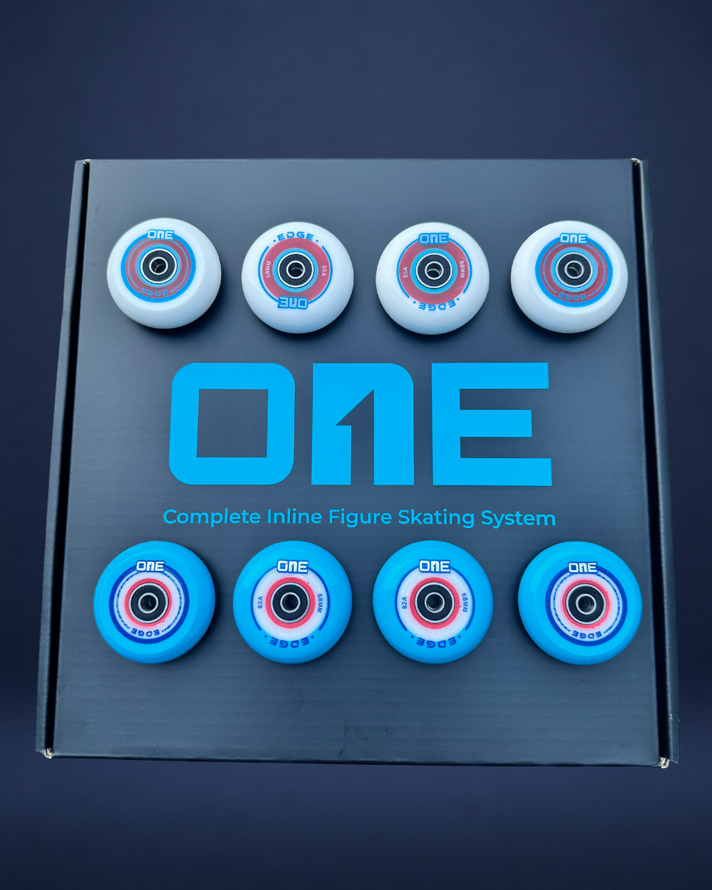 Box of inline figure skating wheels with 'ONE' branding on a dark background