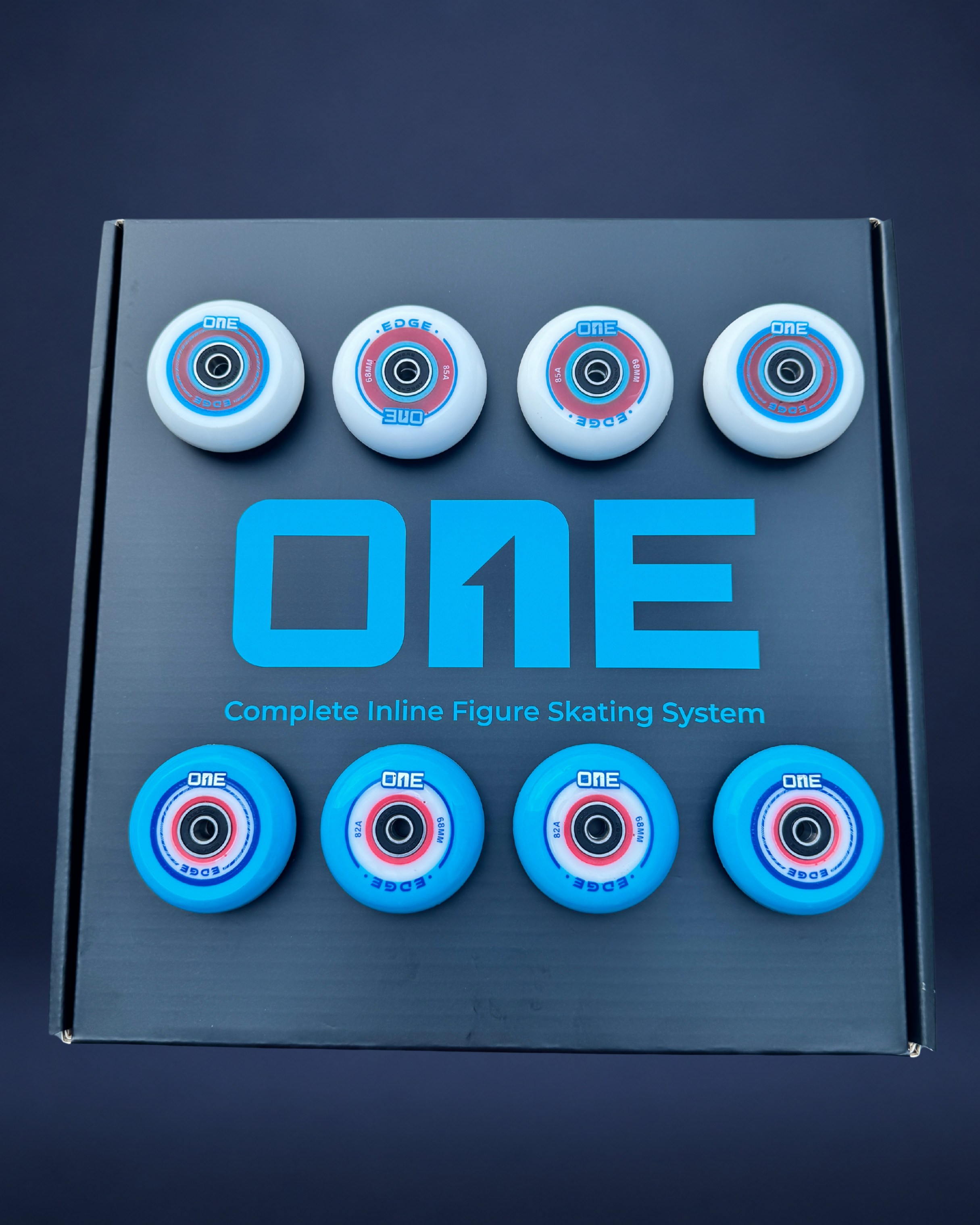 Box of inline figure skating wheels with 'ONE' branding on a dark background